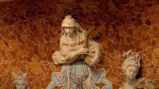A muse with a headdress playing a lute