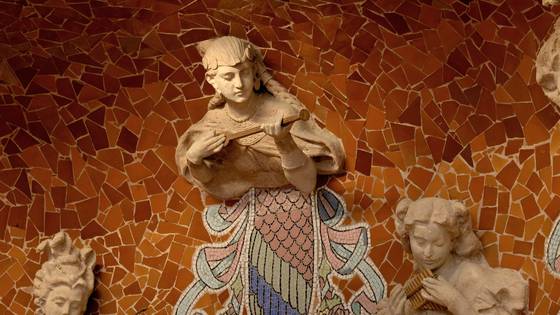 A muse with a mandolin above a muse holding a violin